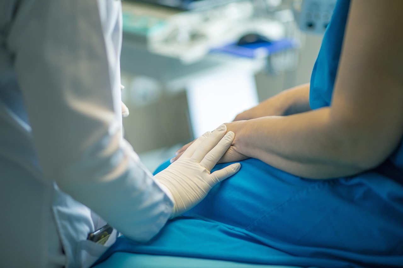 doctor and patient interacting happily in a clinic